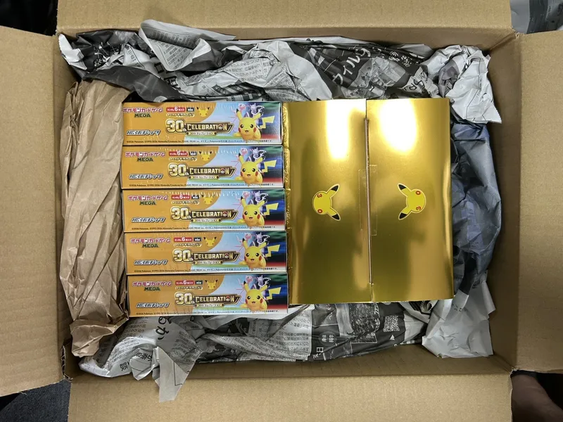 Pokémon 30th CELEBRATION boxes being packed for shipping